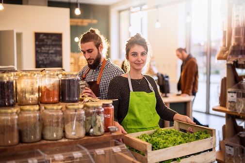 couple working in a bulk food store