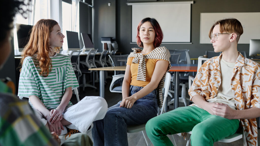 asian girl speaking during group therapy session