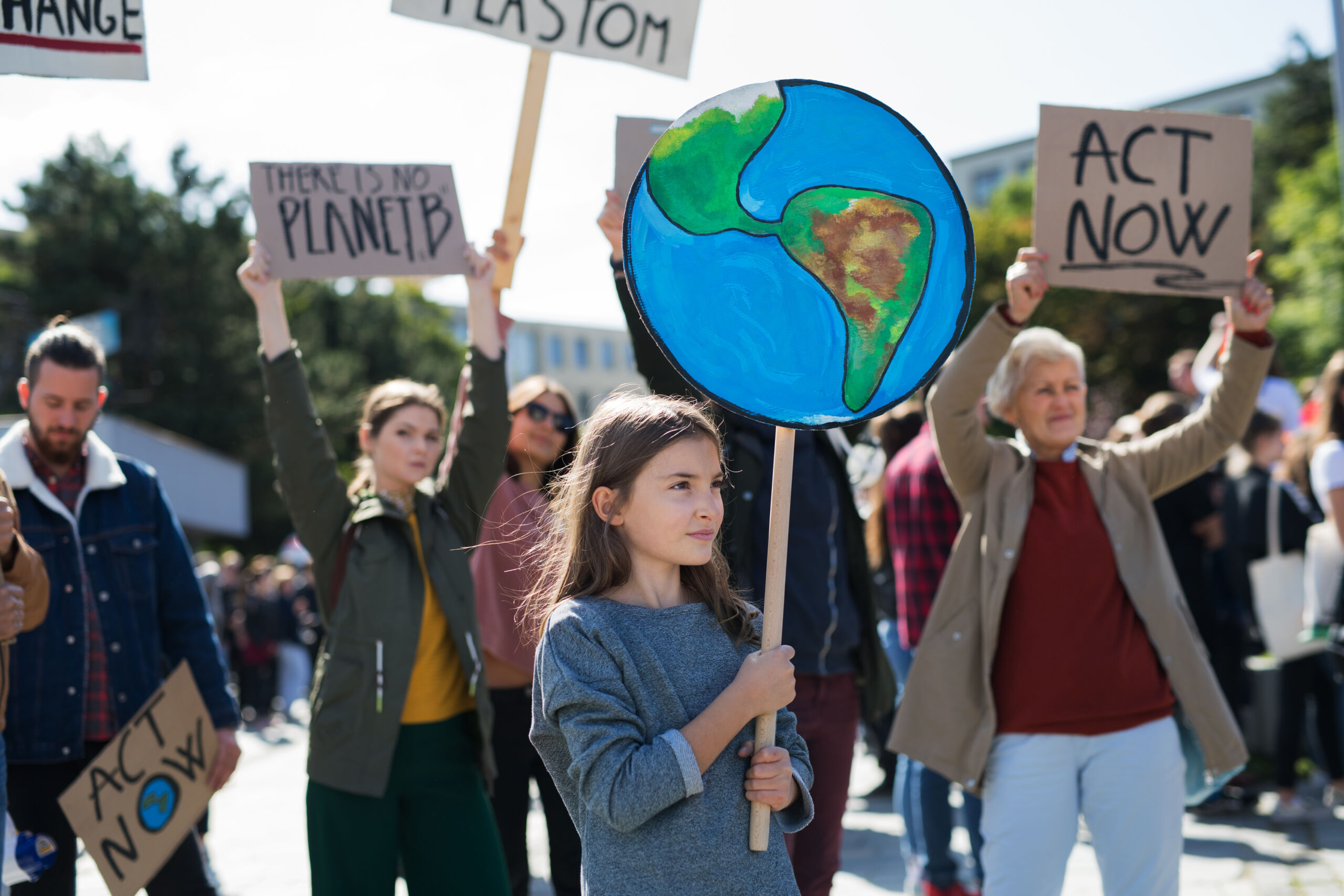people with placards and posters on global strike for climate change.