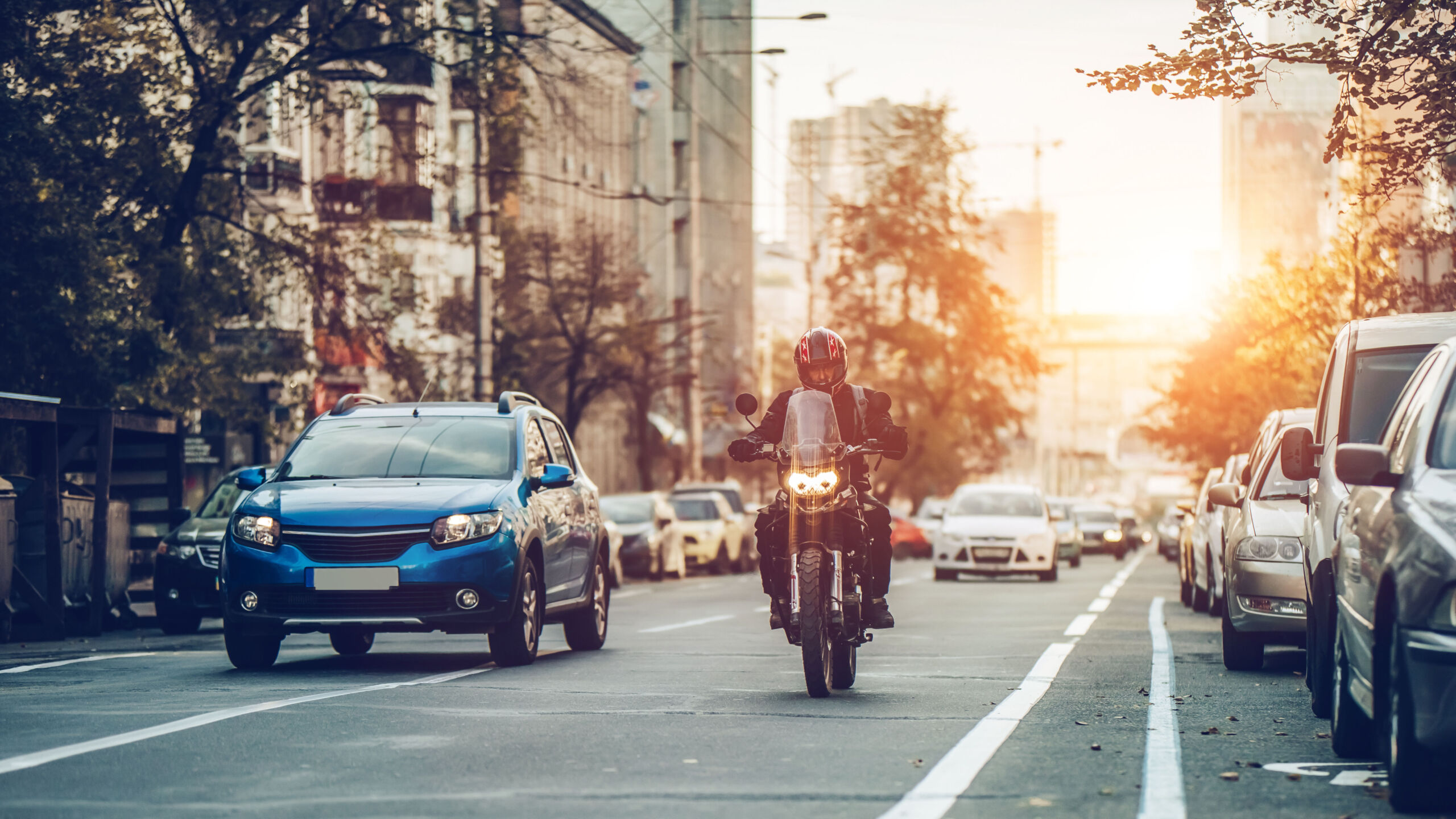 motorcycle and cars on street