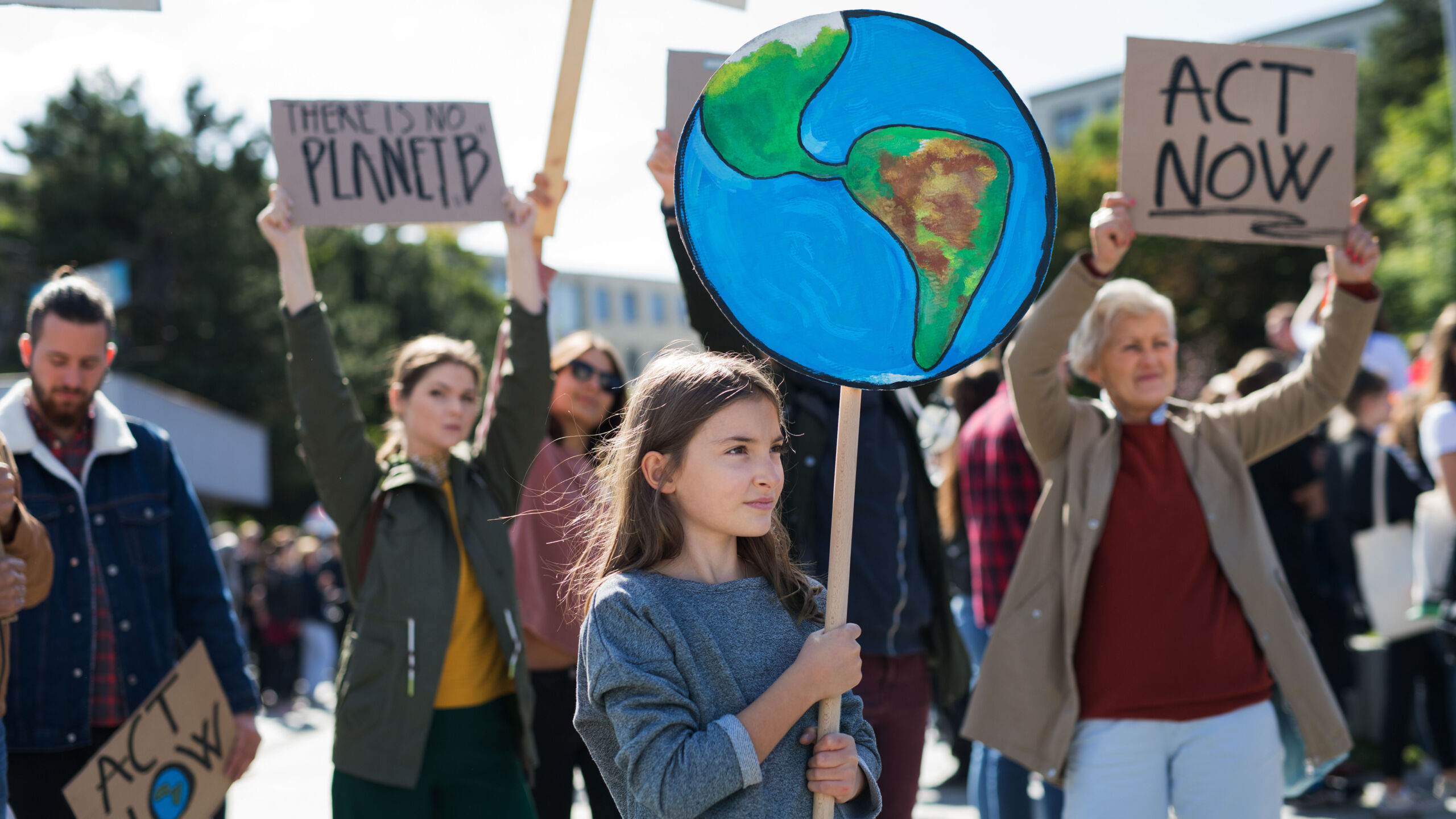 people with placards and posters on global strike for climate change.