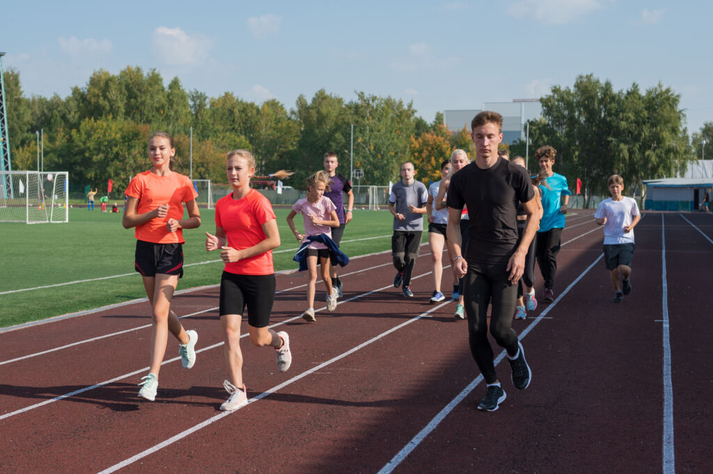 group of young athletes training at the stadium
